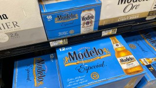 Case of Modelo, a beer imported from Mexico, are seen for sale at a grocery store in Arlington, Virginia, February 3, 2025, following the announcement of tariffs by US President Donald Trump on important goods from Canada and Mexico.
