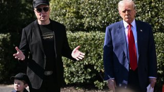 U.S. President Donald Trump and Tesla CEO Elon Musk, alongside Musk’s son X Æ A-Xii, speak to the press as they stand next to a Tesla vehicle on the South Portico of the White House in Washington, D.C., on March 11, 2025.