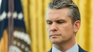 U.S. Defense Secretary Pete Hegseth looks on, as President Donald Trump (not pictured) delivers remarks, in the Oval Office at the White House, in Washington, D.C., U.S., March 21, 2025. 