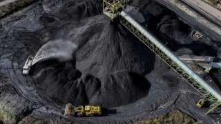 A drone view shows coal being prepared for transport, along the Kanawha river outside of Charleston, West Virginia, March 19, 2025. 