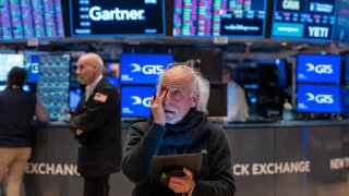 Traders work on the floor of the New York Stock Exchange.