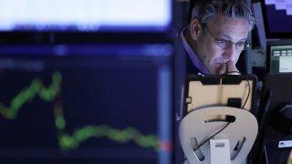 A trader works on the floor of the New York Stock Exchange (NYSE) at the opening bell in New York City, on April 3, 2025.
