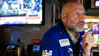 Traders work on the floor of the New York Stock Exchange during morning trading on April 03, 2025 in New York City.