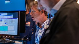 Traders work on the floor of the New York Stock Exchange on April 4, 2025.
