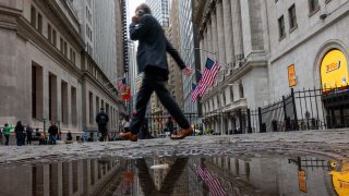 People walk by the New York Stock Exchange on April 4, 2025 in New York City.