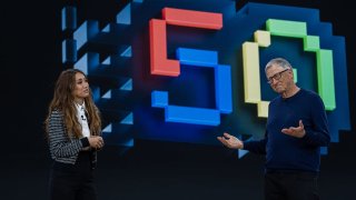 Former Microsoft CEO Bill Gates, right, chats with actor Brenda Song during an event celebrating the 50th anniversary of Microsoft, in Redmond, Washington, April 4, 2025.