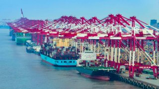 Container vessels and shipping containers at Yangshan Deep-Water Port on Oct. 18, 2024, in Shanghai, China.