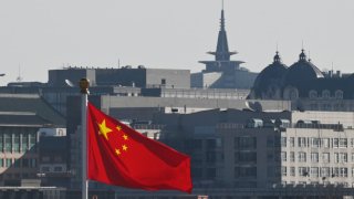 The Chinese flag flies in Tiananmen square, as seen from the Great Hall of the People where meetings of the National People’s Congress continued in Beijing on March 6, 2025.