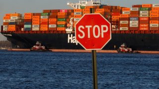 A cargo ship sits outside of the Port of Elizabeth marine terminal seen from Bayonne, New Jersey, U.S., April 9 2025.