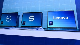 Dell, HP, and Lenovo laptops equipped with Intel Core Ultra processors, optimized for premium thin and powerful laptops, featuring 3D performance hybrid architecture, advanced AI capabilities, and built-in Intel Arc GPU, on display at the Consumer Electronics Show (CES) 2025, in Las Vegas, Nevada, USA, on January 8 2025.