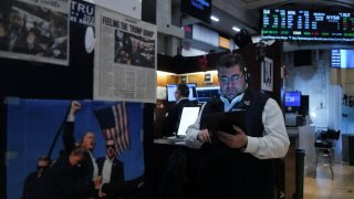 Traders work on the floor at the New York Stock Exchange (NYSE) in New York City, U.S., April 10, 2025. 
