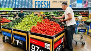 People shop for produce at a Walmart in Rosemead, California, on April 11, 2025.