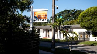 A “For Sale” sign stands at a house in Miami, Florida, U.S. April 16, 2025.