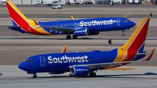 A Southwest Airlines Boeing 737 airplane departs from Harry Reid International Airport as another airplane taxis in Las Vegas, Nevada, on March 15, 2025.