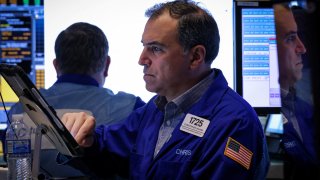Traders work on the floor at the New York Stock Exchange in New York City, U.S., April 28, 2025.