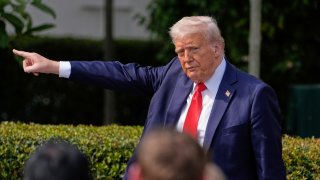 President Donald Trump gestures to the crowd as he departs after welcoming the 2025 College Football National Champions, the Ohio State University football team, during an event on the South Lawn of the White House, Monday, April 14, 2025, in Washington.