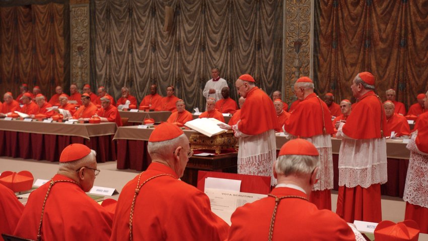 FILE - Italian Cardinal Giacomo Biffi, center, takes an oath at the beginning of the conclave to elect the next pope in the Sistine Chapel at the Vatican, Monday, April 18, 2005.