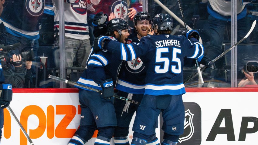 Winnipeg Jets players celebrate goal