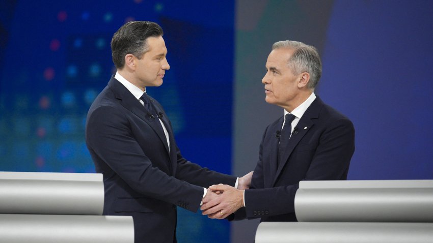 Conservative leader Pierre Poilievre and Prime Minister Mark Carney, head of the Liberal Party, shake hands after a debate in Montreal on April 17.