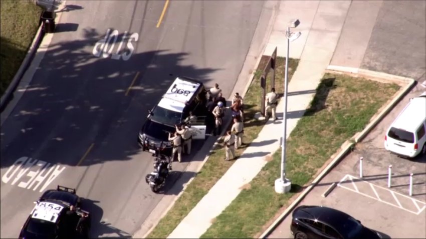 Police opened fire on an armed woman after a hit-and-run suspect ran into her Eagle Rock home while trying to evade officers.