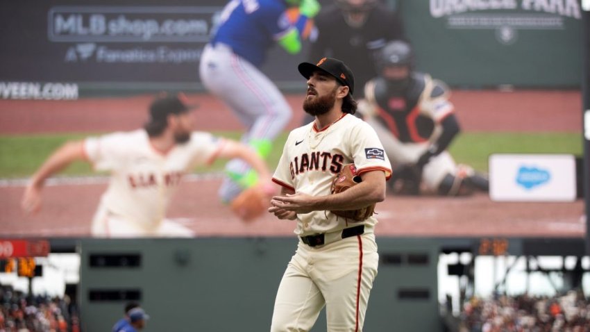 Apr 26, 2025; San Francisco, California, USA; San Francisco Giants pitcher Ryan Walker (74) walks off the field after striking out Texas Rangers pinch hitter Joc Pederson during the ninth inning at Oracle Park. Mandatory Credit: D. Ross Cameron-Imagn Images