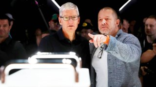 Apple CEO Tim Cook, left, and Apple chief design officer Jony Ive look at the new Mac Pro during the 2019 Apple Worldwide Developer Conference, or WWDC, at the San Jose Convention Center in San Jose, California, June 3, 2019.