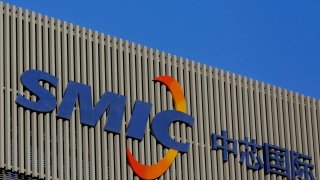 A logo hangs on the building of the Beijing branch of Semiconductor Manufacturing International Corporation (SMIC) on December 4, 2020 in Beijing, China.