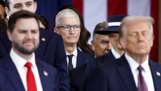 Apple CEO Tim Cook, center, watches during the inauguration ceremonies for President Donald Trump and Vice President JD Vance, left, in the rotunda of the U.S. Capitol in Washington on Jan. 20, 2025.