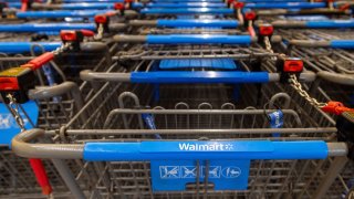 Shopping carts are lined up inside a Walmart store in Hamilton, Ontario, Canada, January 28, 2025.