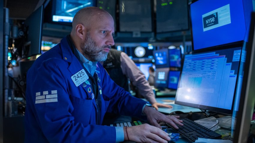 Traders work on the floor of the New York Stock Exchange on Feb. 13, 2025. 