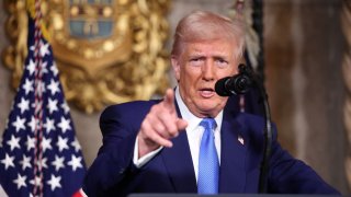 U.S. President Donald Trump points as he speaks at Mar-a-Lago in Palm Beach, Florida, U.S., Feb. 18, 2025.
