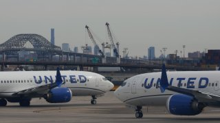 United Airlines airplanes proceed to a runway at Newark Liberty International Airport in Newark, New Jersey, on Feb. 20, 2025.
