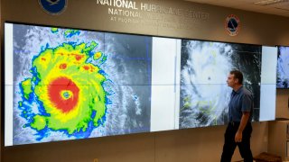 John Cangialosi, Senior Hurricane Specialist at the National Hurricane Center, inspects a satellite image of Hurricane Beryl, the first hurricane of the 2024 season, at the National Hurricane Center on July 1, 2024 in Miami, Florida.