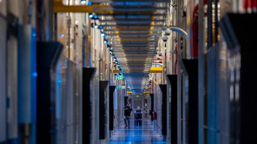People walk through the hallways at Equinix Data Center in Ashburn, Virginia, on May 9, 2024.