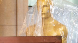 An Oscar statue being set up on the red carpet for the 97th Academy Awards at the Dolby Theatre on Feb 28, 2025, in Hollywood, California.