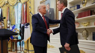 U.S. President Donald Trump shakes hands with former U.S. Senator David Perdue during Perdue’s swearing-in ceremony to be the new U.S. ambassador to China, at the White House in Washington, D.C., U.S., May 7, 2025.