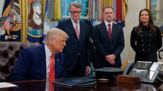 President Donald Trump listens as Prime Minister Keir Starmer of Britain speaks to him on the speaker phone in the Oval Office at the White House on May 08, 2025 in Washington, DC.