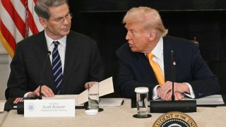 US Secretary of Treasury Scott Bessent and US President Donald Trump speak as they attend the White House Crypto Summit in Washington, DC, March 7, 2025.