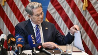 US Treasury Secretary Scott Bessent looks at a note during a news conference in Geneva on May 12, 2025, to give details of “substantial progress” following a two-day closed-door meeting between US and China top officials aimed at ending a devastating tariff war.