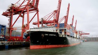 A cargo ship moors at the container terminal berth of Lianyungang Port for loading and unloading containers in Lianyungang City, Jiangsu Province, China, on May 9, 2025.