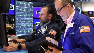 Traders work on the floor at the New York Stock Exchange on May 13, 2025.