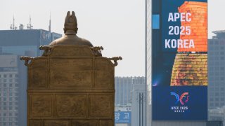 SEOUL, SOUTH KOREA – 2025/04/16: An APEC 2025 large-scale promotional video and a statue of King Sejong the Great are seen at Gwanghwamun Square in central Seoul.