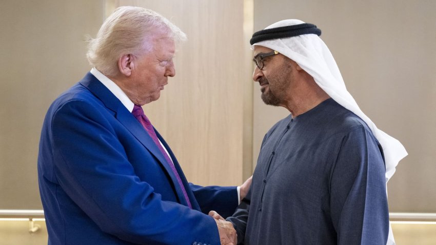 UAE President Sheikh Mohamed bin Zayed Al Nahyan (R) welcomes U.S. President Donald Trump upon arrival at the presidential terminal in Abu Dhabi on May 15, 2025.