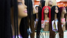 Braided wigs are seen on display at Chapel Beauty, a beauty supply store in Decatur, Ga., Monday, May 5, 2025. (AP Photo/Stephanie Scarbrough)