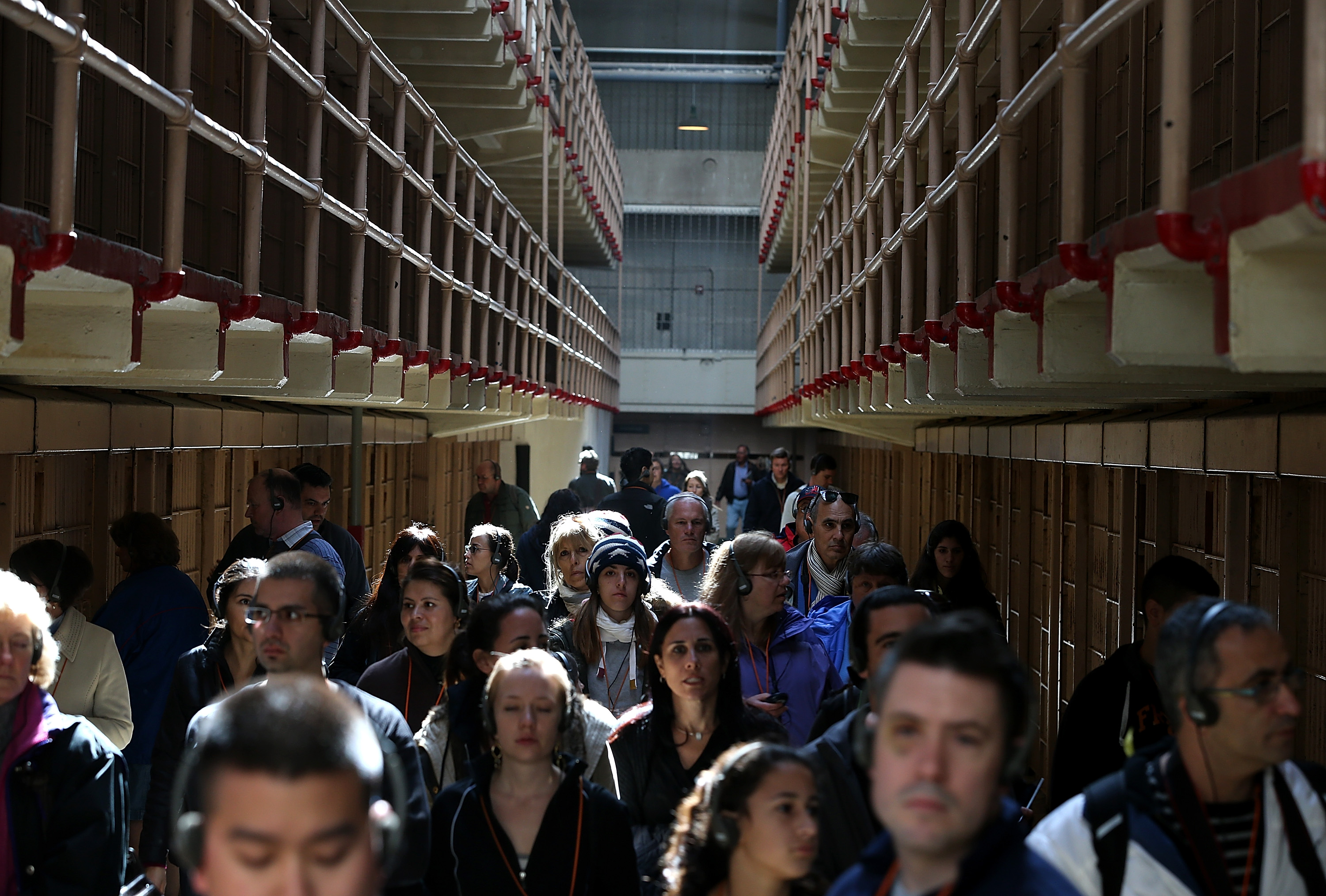 Tourists walk through the main cell block at Alcatraz Island