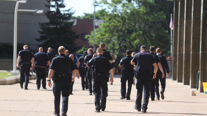 July 23, 2022; Rochester, NY, USA; Rochester police officers head back to the Public Safety Building after Kelvin Vickers, 21, was arraigned in Rochester City Court in Rochester, NY on Saturday, July 23, 2022.  He was charged with second-degree murder, attempted second-degree murder, second-degree assault, and two counts of second-degree criminal possession of a weapon.  Vickers is accused of shooting two Rochester police officers, Anthony Mazurkiewicz, 54, and Sino Seng,37.  Mazurkiewicz died from his wounds. Mandatory Credit: Tina MacIntyre-Yee-USA TODAY NETWORK