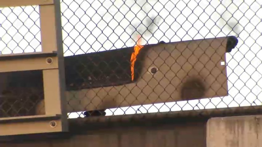 Flames burning on the track area at the San Leandro BART station. (May 20, 2025)