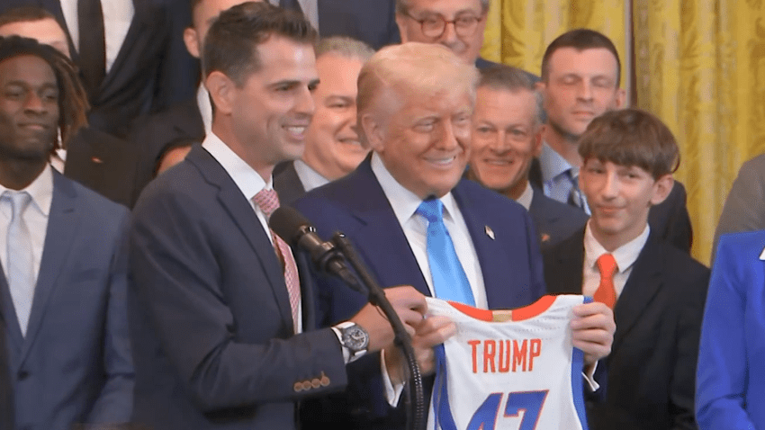 TRUMP HOLDS UP 47 JERSEY