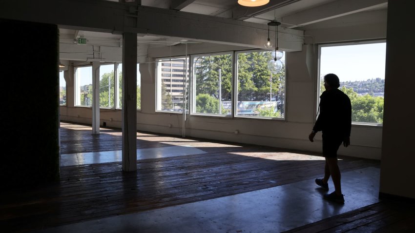 Collin Madden, founding partner of GEM Real Estate Partners, walks through empty office space in a building they own that is up for sale in the South Lake Union neighborhood in Seattle, Washington, May 14, 2021.