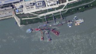This satellite image from Planet Labs PBC shows what appears to be a sunken Chinese submarine at a shipyard near Wuhan, China, on June 15, 2024.